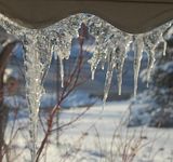 DSC_1052.jpg One of the more interesting natural \'ice sculptures was hanging from the awning over the picture window. It was only there briefly, but I managed to get a few shots through the dirty window. Sony H5. image by Shut-R-Bug