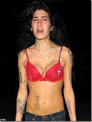 DistressedAmyWinehousewandersthestr.jpg