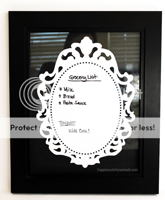 deco laminate frame with grocery list written on it 