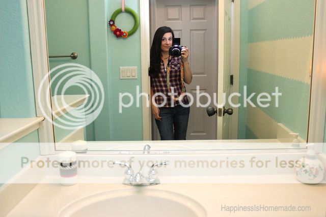 heidi from happiness is homemade taking photo of bathroom
