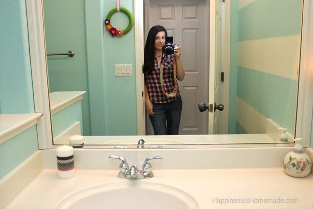 heidi from happiness is homemade taking photo of bathroom