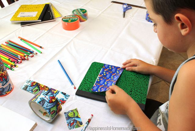 kids making custom school supplies using duck tape