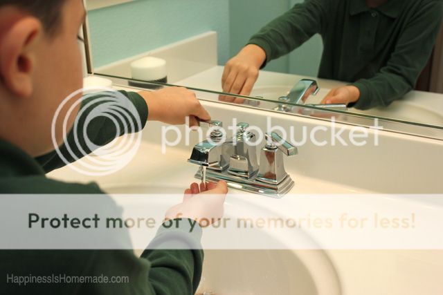 child using brand new bathroom sink faucet