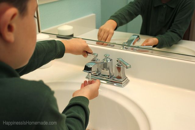 child using brand new bathroom sink faucet