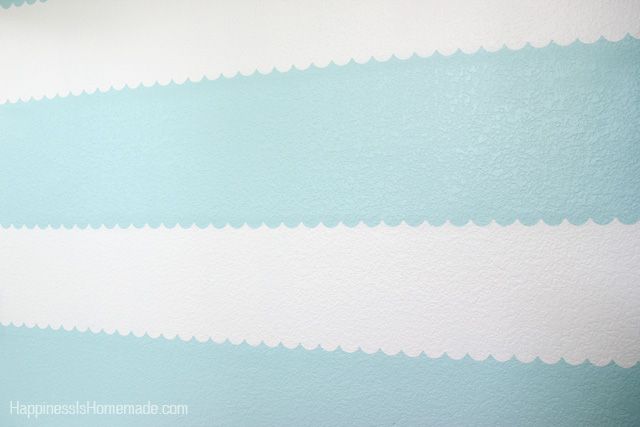 blue and white scalloped lines on painted wall