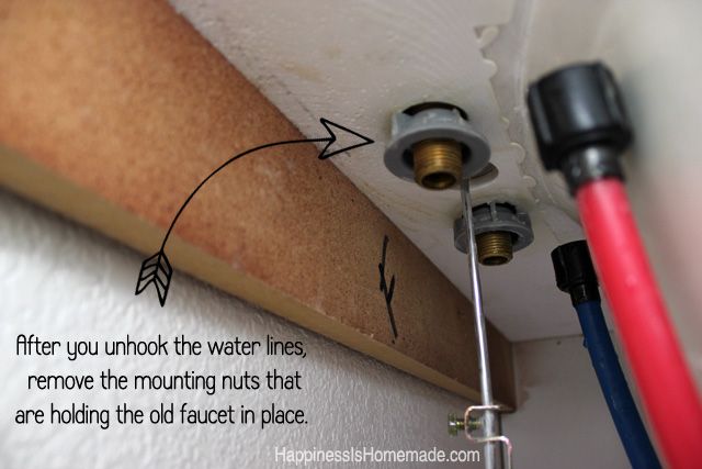 arrow drawn on under sink photo with instructions for unhooking the water lines