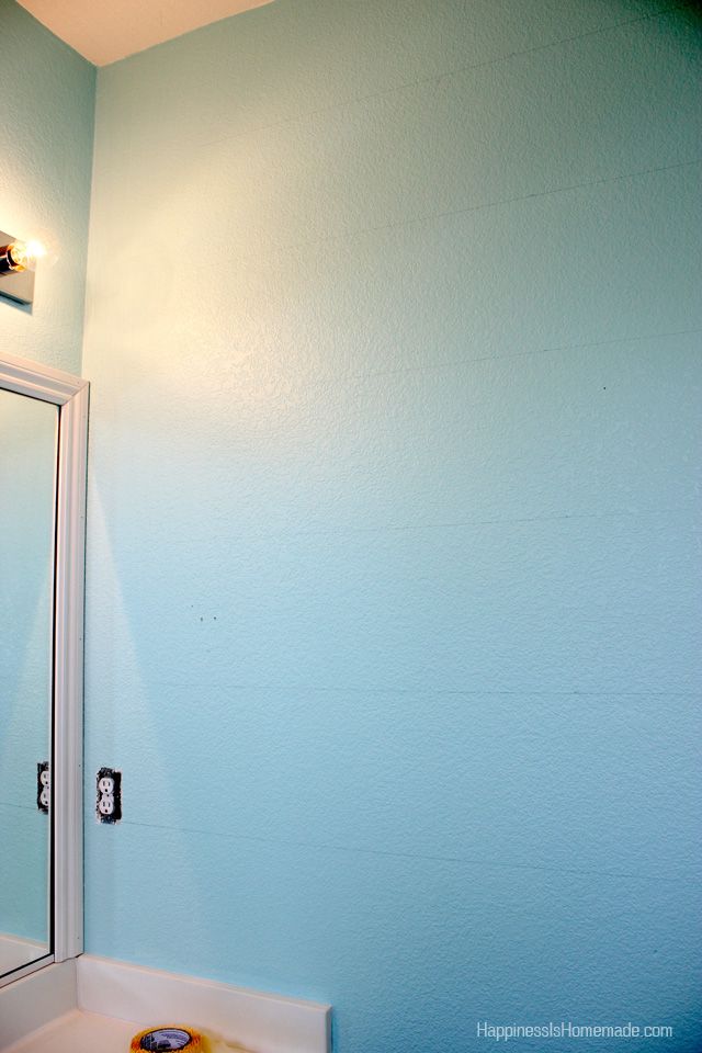 lightly marked stripes on blue wall